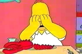Homer Simpson at the table crying over his dead pet, Pinchy the Lobster.