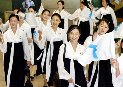 North Korean cheerleaders in white tops and black dresses
