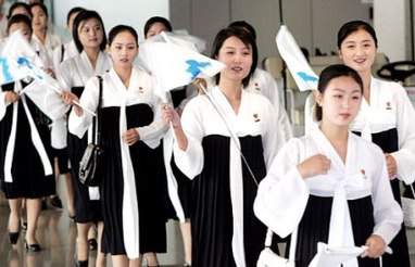 North Korean cheerleaders in white tops and black dresses