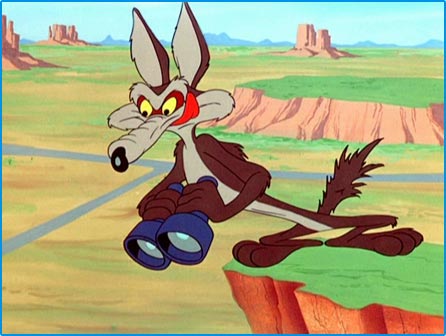 Wile E. Coyote licking lips on top of a cliff while holding binoculars