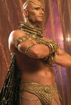 Xerxes from the movie 300. He is half-naked and covered in gold jewelry.