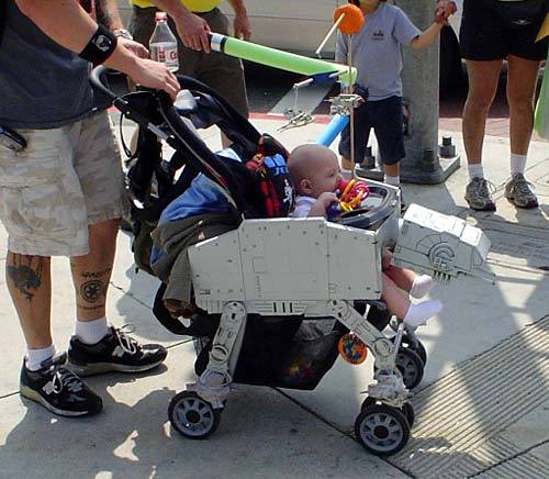 A baby stroller fitted out to look like an Imperial AT-AT walker from Star Wars: The Empire Strikes Back