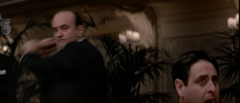 Al Capone (Robert de Niro) swings a bat at the head of a disloyal gangster. From The Untouchables.