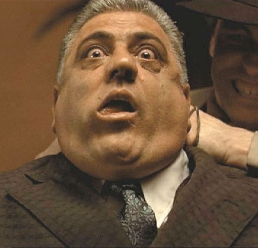 Luca Brasi garotted while meeting with Virgil Sollozzo in The Godfather