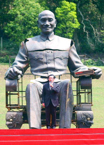 KMT chairman Ma Ying-jeou giving speech while standing at crotch-level in front of giant statue of dictator Chiang Kai-shek.