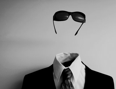 Invisible man wearing suit, tie, and sunglasses