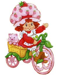 Strawberry Shortcake on her tricycle.