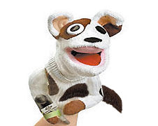 Sockpuppet dog that's taken off his mustache and holds it under his arm