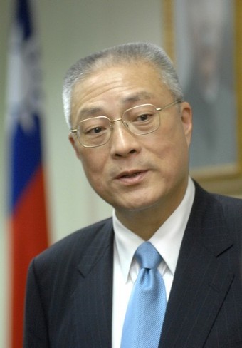 KMT Premier Wu Den-yih. He is graying with short hair, and wears a suit and tie.