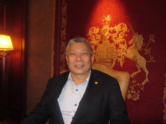 Pro-Communist, Uncle Com, Taiwanese businessman Tsai Eng-meng sits in an opulent room. ☭