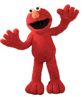 Elmo doll in a happy, friendly pose