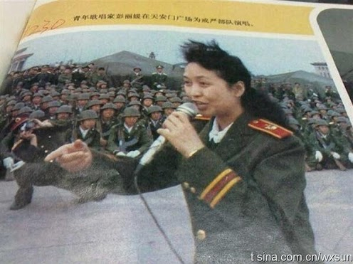 Evil Chinese cunt Peng Liyuan, wife of Chinese dictator Xi Jinping, rejoicing and entertaining the troops after the Tiananmen Square Massacre 1989.
