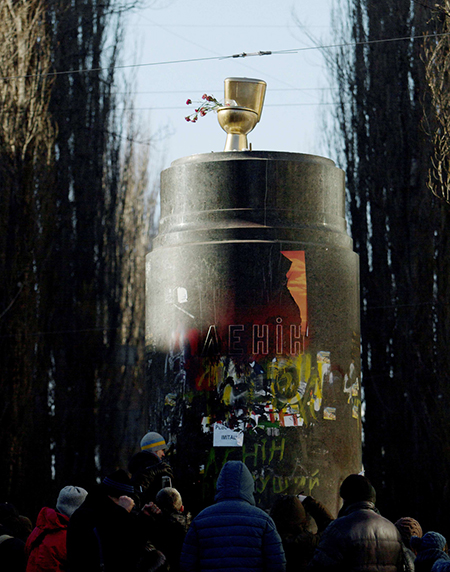 Lenin statue in Ukraine replaced by golden toilet on top of his pedestal.