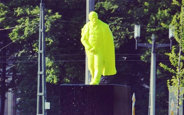 Neon green urinating Lenin statue in Poland.