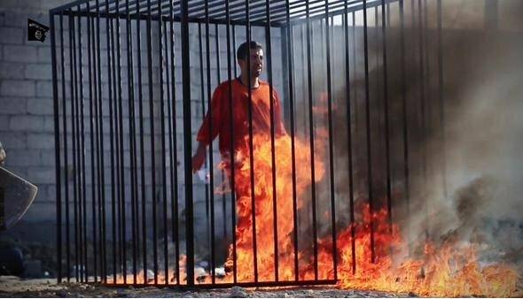 Flames begin to immolate Jordanian pilot Lieutenant Moaz al-Kasasbeh.