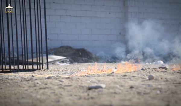 Trail of flame leading to cage holding Jordanian Pilot Lieutenant Moaz al-Kasasbeh before he's burned alive by ISIS.