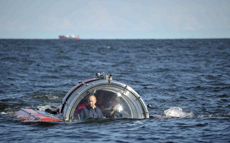 Vladimir Putin on surface of ocean in a submersible
