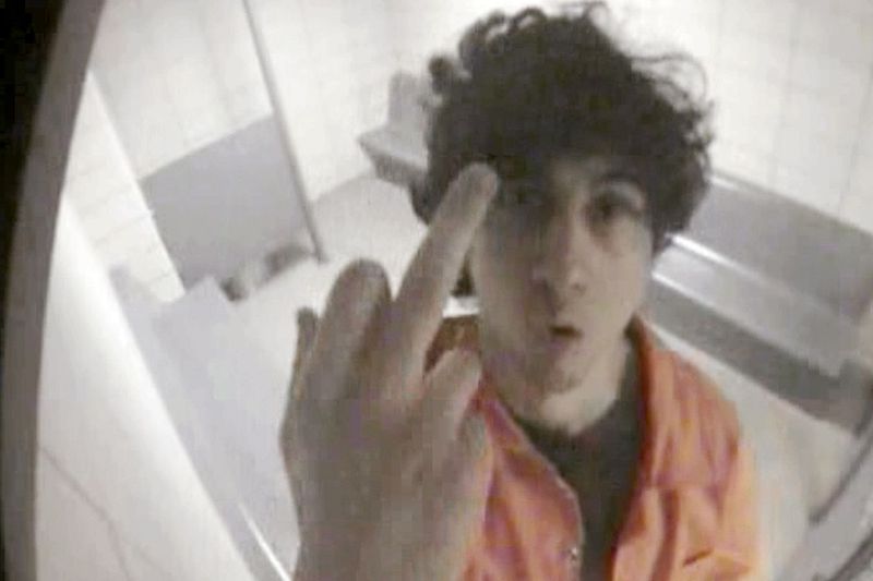 Boston Islamofascist terrorist Dzhokhar Tsarnaev extends middle finger to cell surveillance camera after Boston bombing.