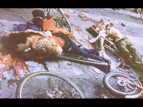 Two Chinese lie dead in pools of their own blood by their bicycles after being machine-gunned by the Chinese Communist Party during the Tiananmen Square Massacre.